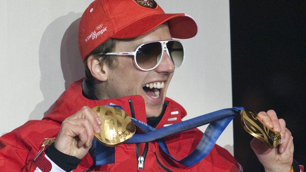 Gold medallist Switzerland's Simon Ammann celebrates during a welcome party in his hometown of Unterwasser February 26, 2010. Ammann won gold medal in the the normal hill individual ski jumping event and one for the large hill ski jumping competition at the Vancouver 2010 Winter Olympics. REUTERS/Miro Kuzmanovic (SWITZERLAND - Tags: SPORT OLYMPICS SKIING) - RTR2AYK3